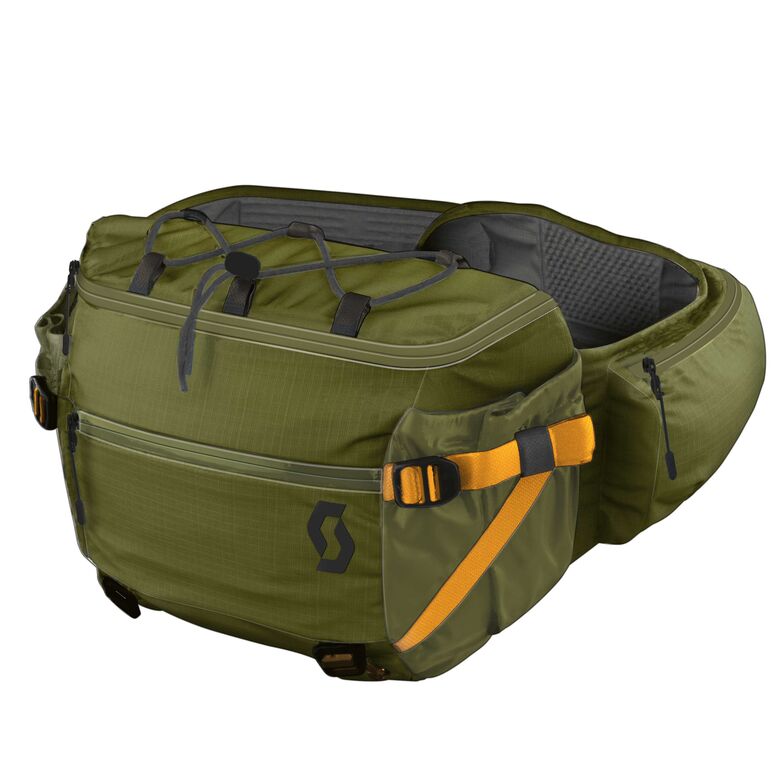 Alles an seinem Platz Zu viel Ausrüstung für die Hosentaschen, aber nicht genug für einen Rucksack? Eine Hüfttasche ist der ideale Kompromiss. Von Scott gibt es neu das Modell Trail 4 Hip Pack. Mit seinem verstellbaren Klettverschluss-Hüftgurt sitzt es sicher auf der Taille. Seitentaschen ermöglichen einen schnellen Zugriff, und Befestigungsriemen fixieren Knieschoner oder andere Gegenstände. Ein Extrafach für Wertsachen und Werkzeuge ist ebenfalls vorhanden. Ab Fr. 50.– scott-sports.com